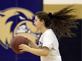 Winston Knoll Wolverines basketball player Meaghan Hamilton during a practice.