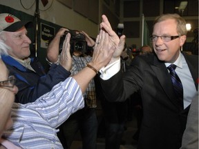 Premier Brad Wall celebrates with supporters following his 2011 provincial election victory.