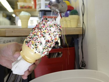 An ice cream gets sprinkles on the opening day of The Milky Way ice cream shop in Regina on Sunday March 13, 2016.