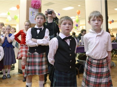 Boys from Clark's Clan of Scottish Dance watch the stage while waiting for their chance to perform during the annual Spring Free from Racism event held at the Italian Club in Regina on Sunday March 20, 2016.