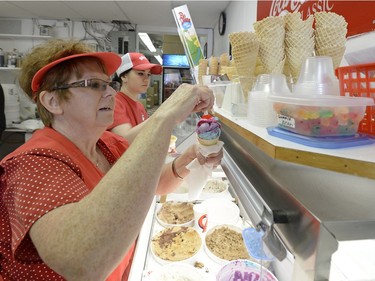 Carole Boldt places a gummy bear on an icecream cone in Regina on Sunday March 13, 2016.