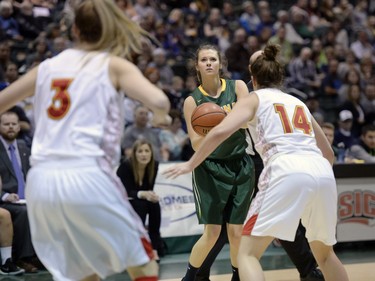 Cougars guard Katie Polishuk takes aim during the second game of a Canada West quarterfinal against the Calgary Dinos in Regina on Saturday March 5, 2016.