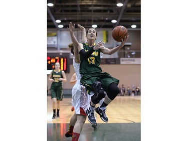 Cougars guard Sidney Dobner goes for two points during the second game of a Canada West quarterfinal against the Calgary Dinos in Regina on Saturday March 5, 2016.