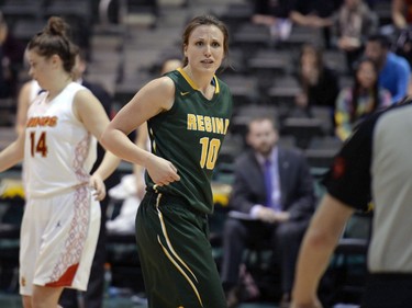 Cougars power forward speaks to an official during the second game of a Canada West quarterfinal against the Calgary Dinos in Regina