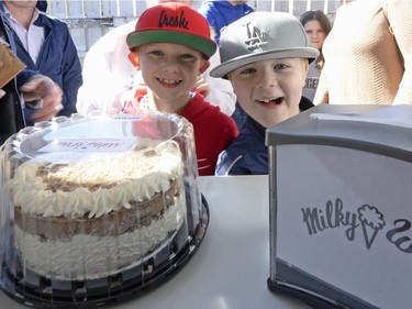 Cousins Merek Casemore and Keaton Hannant wait for their treats on the opening day of The Milky Way ice cream shop in Regina on Sunday March 13, 2016.