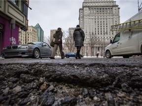 A deep pothole on the asphalt in downtown Montreal, which is plagued this spring by the kind of rutted roads Reginans are familiar with.