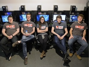 Josh Carroll, Ryan Bosgoed, Jocelyn Fraser, Dylan Carroll and Chad Bosgoed, from left, sit in front of computers at Matrix Gaming Centre in Regina on Sunday Feb. 28, 2016.