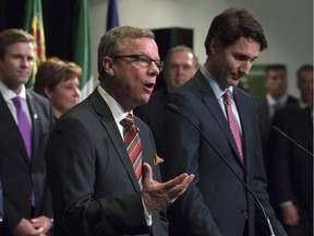 Prime Minister Justin Trudeau listens as Saskatchewan Premier Brad Wall responds to a question during a First Ministers meeting in Ottawa in November.