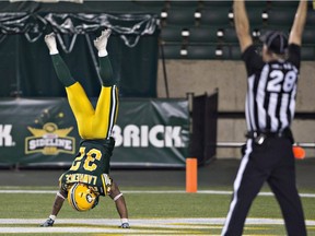 The Saskatchewan Roughriders hope that their fans will flip over Kendial Lawrence, left, who is shown celebrating a touchdown with the Edmonton Eskimos last season.