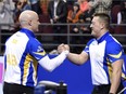 Kevin Koe (left) and Ben Hebert are off to the men's world curling championship later this week in Basel, Switzerland.