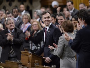 Finance Minister Bill Morneau receives applause as he tables the federal budget in the House of Commons in Ottawa on Tuesday, March 22, 2016.