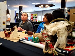 Evynn Cyr, 11, left and Montana Bellegarde with their at the 2016 File Hills Qu'Appelle Tribal Council Science Fair. The pair compared nutritional value of traditional dry meat to contemporary beef jerky. (FHQTC supplied)