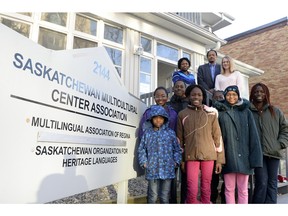 Ola Tundun, top left, teacher, Girma Sahlu, top middle, president of Saskatchewan Organization for Heritage Languages (SOHL) and Tamara Ruzic, top right, executive director of SOHL pose with students out front of their head office in Regina.