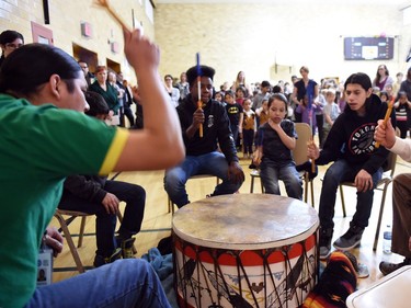 Drummers from the Sheldon Collegiate drum group sing an honour song during an assembly at the temporary École Connaught Community School, located at 4210 4th Avenue in Regina on February 29, 2016.