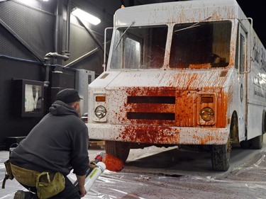 Second assistant special effects person Joel Alton performing blood effects on a Santa's Helpers van at the Soundstage in Regina. WolfCop 2 is wrapping up filming.