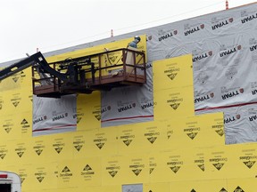 Construction crews install sheathing at Focus Eye Care Specialists new  building in Regina. Queen City Construction in the construction manager. The two-storey building at 101 E Victoria Ave. was issued a  building permit valued at $1 million in August 2014.