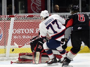Adam Brooks of the Regina Pats scores on Moose Jaw Warriors goalie Zach Sawchenko during WHL action on Friday at the Brandt Centre.