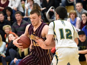 Carter Millar, left, shown in the Regina Intercollegiate Basketball League's senior boys large schools final, had 41 points Friday to help the LeBoldus Golden Suns advance to Saturday's provincial 5A boys final.