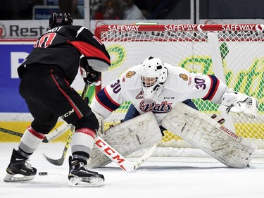 Tanner Jeannot with the Moose Jaw Warriors shoots on Pats  goalie Jordan Hollett during WHL hockey action at the Brandt Centre in Regina on March 11, 2016.