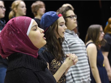 Esraa Naser (L), from Iraq and a student in the concert choir at F.W. Johnson Collegiate performing during Diversity Day celebrating the International Day for the Elimination of Racism on March 21, 2016.