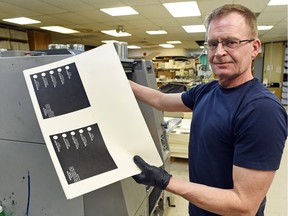 REGINA SK: MARCH 21, 2016 — Grant Hubick with Regina Pasqua constituency election ballots coming off the press at Signature Print-It.