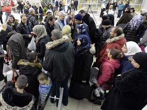 Syrian refugees arriving at Regina International Airport in January.