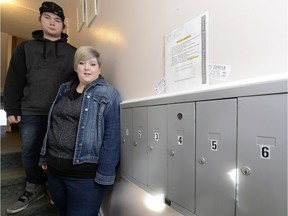 Jesse Hagley and Kirsten Fahlman stand beside their mailbox. After ordering engagement rings on eBay in December, Canada Post scanned the package as delivered, but the couple never received it.