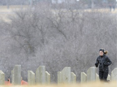 Gina Soprano of Regina didn't let a little snow stop her from her run in the Douglas Park area of Wascana Centre Wednesday afternoon.