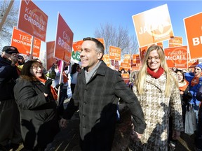 Cheered by supporters, NDP leader Cam Broten arrives for the leaders' debate at the Regina CBC headquarters on Wednesday.