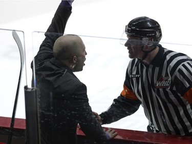 Hurricane's head coach Brent Kisio argues with the ref after  Carter Folk is escorted off the ice after a game misconduct during game three of WHL playoff action between the Lethbridge Hurricanes and the Regina Pats at the Brandt Centre in Regina Tuesday night.