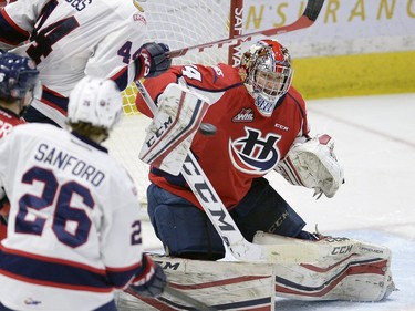 Lethbridge goal tender Stuart Skinner makes a blocker save in front of Pats Connor Hobbs during game three of WHL playoff action between the Lethbridge Hurricanes and the Regina Pats at the Brandt Centre in Regina Tuesday night.
