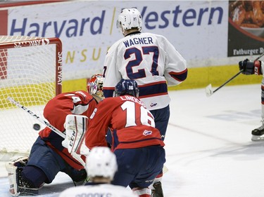 Pats' Austin Wagner looks on as Sam Steel puts the second Pats goal past  Lethbridge goal tender Stuart Skinner during game three of WHL playoff action between the Lethbridge Hurricanes and the Regina Pats at the Brandt Centre in Regina Tuesday night.