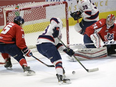 Pats' Sam Steel can't find the handle as Hurricane's Tyler Wong and Stuart Skinner look on during game three of WHL playoff action between the Lethbridge Hurricanes and the Regina Pats at the Brandt Centre in Regina Tuesday night.