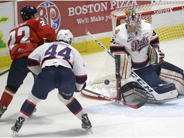 Pats goalie Tyler Brown and Connor Hobbs watch as Hurricanes Egor Babenko hits the side of the net during game four of WHL playoff action between the Lethbridge Hurricanes and the Regina Pats at the Brandt Centre in Regina Wednesday night.