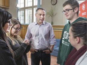 NDP leader Cam Broten with students at St. Andrews College at the University of Saskatchewan.