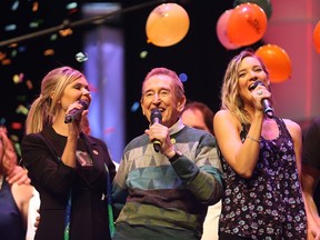 Beverley Mahood, left, and Bob McGrath sing during his last Telemiracle telethon at TCU Place in Saskatoon on March 8, 2015.
