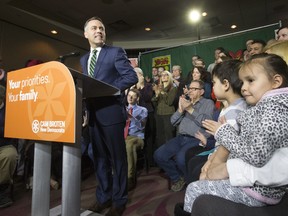 SASKATOON,SK--FEBRUARY 17/2016   0318 news cam broten---  NDP leader Cam Broten speaks during a news conference at TCU Place as five-year-old twins Connor and Devon Hicks, far right, listen, Thursday, March 17, 2016.   (GREG PENDER/ SASKATOON STARPHOENIX)