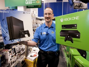 Best Buy General Manager Lawrence Eberle had to show was empty display boxes for Xbox One and PS4 at the store Friday, November 22, 2013. The available Xbox units sold out overnight.