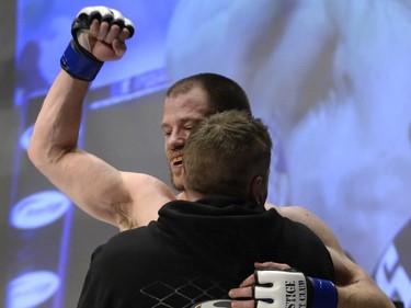 Sean Quinn beats Chris Day at the end of a bout at the Queen City Coronation, an MMA event held at the Orr Centre in Regina on Saturday March 12, 2016.