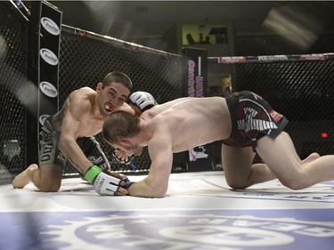 Sean Quinn, right, and Chris Day grapple during the Queen City Coronation, an MMA event held at the Orr Centre in Regina on Saturday March 12, 2016.