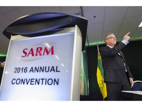 Brad Wall points before speaking during a meeting of the Saskatchewan Association of Rural Municipalities held at Queensbury Place in Regina on Wednesday March 9, 2016.