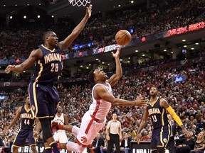 Indiana Pacers&#039; Ian Mahinmi (28) guards the net as Toronto Raptors&#039; Kyle Lowry (7) falls on his way to the hoop during second half round one NBA basketball playoff action in Toronto on Saturday, April 16, 2016. THE CANADIAN PRESS/Frank Gunn