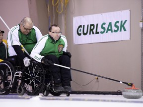 Darwin Bender, skip of Team Saskatchewan, throws during the first end of the gold-medal game of the Canadian wheelchair curling championship at the Callie.