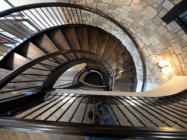 A curved staircase and stone walls are among the unique features in the "miniature castle" home built by Katrina Stettner and Matt Rogina in Greens on Gardner.