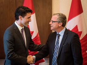 Prime Minister Justin Trudeau shakes hands with Premier Brad Wall in Saskatoon earlier this year.