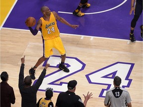 Los Angeles Lakers star Kobe Bryant puts up one of his 50 shots during Wednesday's game against the Utah Jazz. Actually, Bryant is just tossing the ball to the other end of the court to celebrate the end of his NBA career.