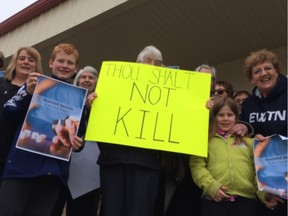 Demonstrators opposed to the federal Liberal government's controversial Bill C-14 outside the east Regina office of MP Ralph Goodale.