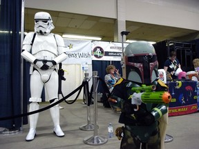Abby Gilmer (right) and her dad Corey (left) stand ready at Fan Expo held at Evraz Place in Regina on Saturday Apr. 25, 2015.