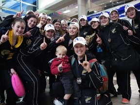 The Weyburn Gold Wings, shown celebrating their 2014 Esso Cup championship at Regina International Airport, are hoping to win another Canadian female midget AAA hockey title. The Gold Wings are playing host to the Esso Cup tournament this week at Crescent Point Place.