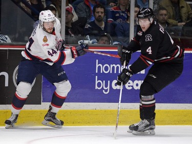 Red Deer Rebels defenceman Haydn Fleury, right, shown alongside the Regina Pats' Connor Hobbs on Tuesday, hails from Carlyle.